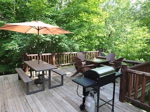 OVERVIEW: The large backyard deck in the summer.