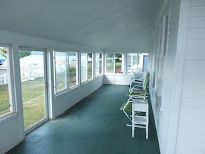 OVERVIEW: The large, fun, and fully-enclosed front porch.