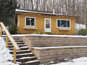 OVERALL:  The outside of the cabin in the winter.