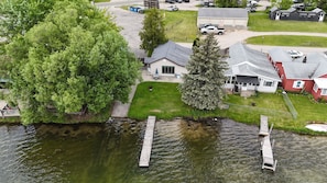 OVERALL:  A drone shot of the house with the dock in view