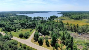 OVERALL: A great aerial photo with the cabin in the foreground and Otsego Lake in the background.