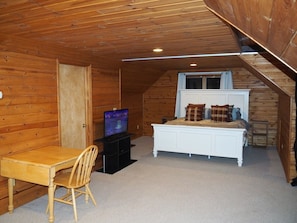 OVERALL: The cabin features a huge upstairs bedroom with it's own television, desk, jetted tub, king-size bed, dresser, mirror, closet, and private en suite bathroom!