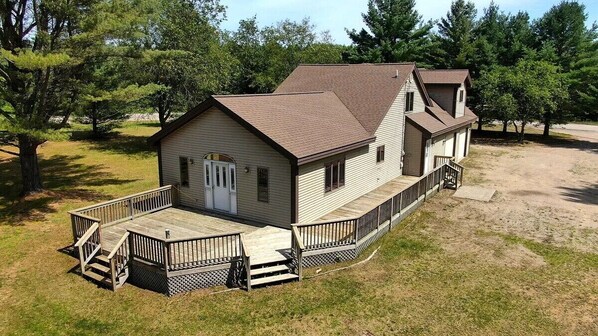 OVERALL:  A good aerial photo highlighting the privacy of the property and the large deck