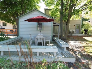 EXTERIOR: The backyard deck, which has a nice dining area.