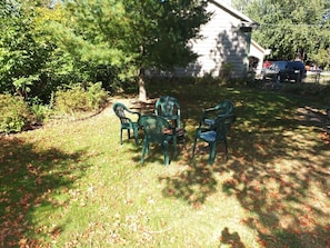 EXTERIOR: There is a fun and family-friendly bonfire ring in the backyard.