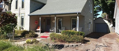  EXTERIOR:  The front of the home facing the street, with the driveway on the right.