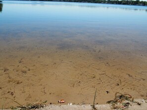 OVERVIEW:  The lakefront has a family-friendly sandy bottom, which is rare and is great for kids to play in the lake.