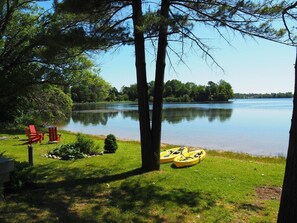 OVERVIEW: The private lakefront, bonfire ring, and kayaks.