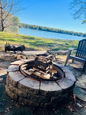 OVERALL:  The home has a fun and family-friendly bonfire pit (with the lake in the background).