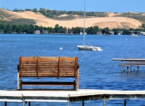 OVERALL:  The private dock on Little Glen Lake with the Sleeping Bear Dunes in the background.