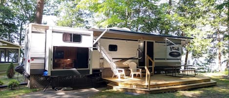 OVERALL: The front of the park home in summer.