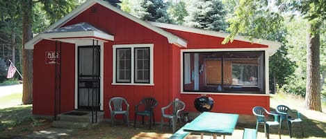 OVERVIEW:  The front of the cabin and the private picnic table for the cabin.