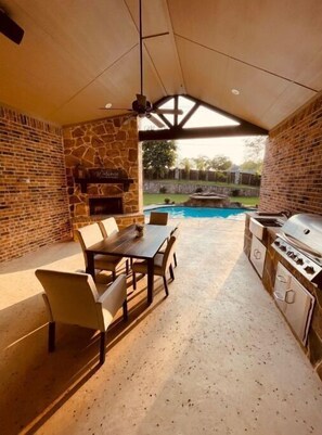 Outdoor dining with outdoor kitchen