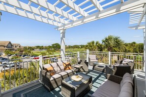 Outdoor seating with ocean and golf views