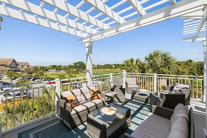 Outdoor seating with ocean and golf views