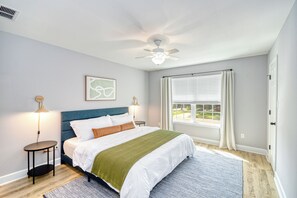 Large bedroom with king-sized bed and huge window