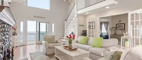 Living  Room with Two And One Half  Story Cathedral Ceilings