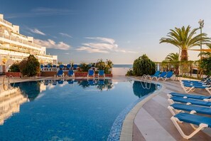 Sea view backdrop on refreshing pool