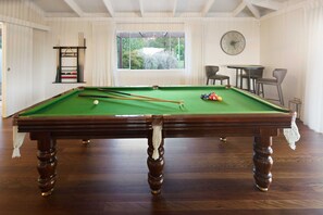 Refine your snooker skills on the provided pool table.