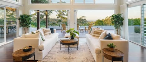 Views of the hinterland paint the perfect backdrop for the open-plan living, kitchen and dining room.