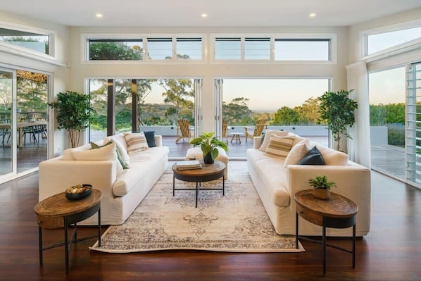 Views of the hinterland paint the perfect backdrop for the open-plan living, kitchen and dining room.
