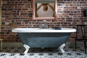 Exquisite claw-foot, free-standing bath in bedroom two's en-suite bathroom