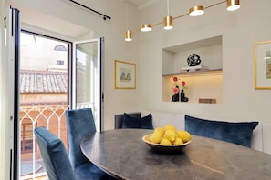 The large French doors allow streams of light into the dining area.