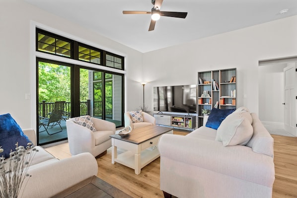 Beautiful living space opens to covered deck