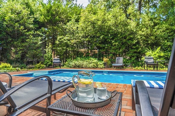 Enjoy a refreshing drink overlooking our private pool