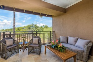 Primary suite's secluded balcony oasis where you can enjoy the sunset views.