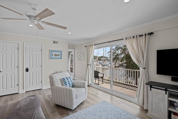 Unwind in our spacious living room with balcony views.