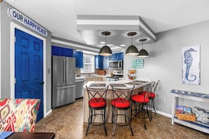 Fully equipped kitchen with large pantry.