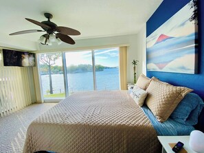 Wake-up to this unobstructed lakefront view from this queen suite