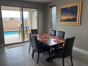 view to the pool area from the dining area