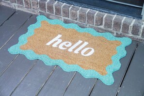 FRONT DOOR WITH KEYLESS ENTRY AND HAPPY PLANTS 
7 DOOR MAT