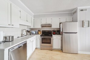 Kitchen area with complete appliances