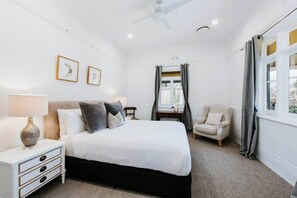 The first bedroom offers a sumptuous queen-sized bed and boasts beautiful ornate detailing.