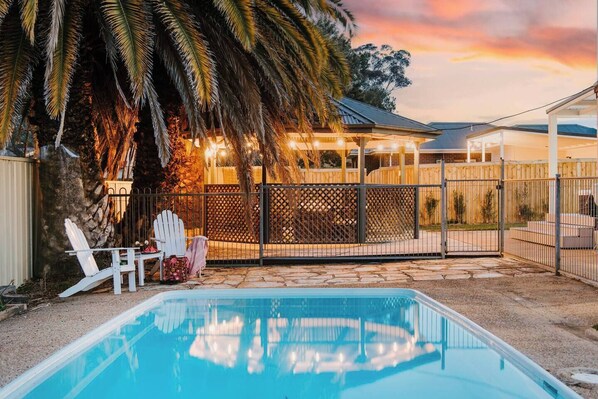 During the summer months, take a dip in the glistening swimming pool or relax in the shade beneath the palms.