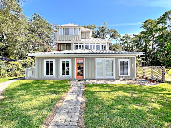 This view is from the patio by the water looking back at the property.