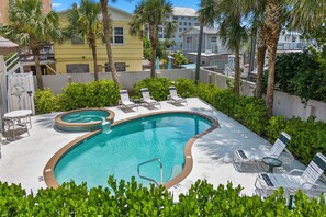 Heated community pool and lounge chairs.