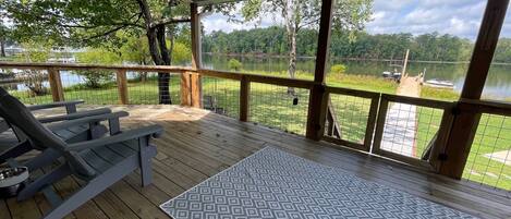 Covered back deck with fan overlooking lake Murray. 