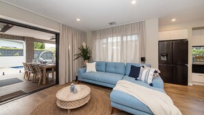 Casa De Praia Open plan living area leading to outdoor area