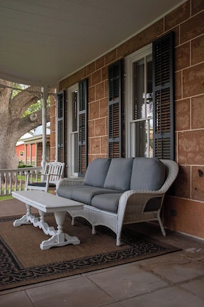 The main entry porch is perfect  to relax and enjoy a cup of coffee or glass of wine.
