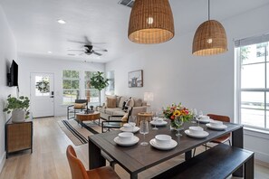 Large table opens to the kitchen to entertain.