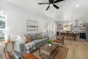 Spacious living room opens up to the kitchen and dining area.