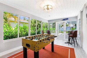 Entertain your guests from this spacious game room!  Complete with mini fridge and flat screen TV!