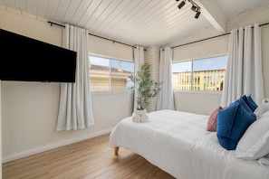 Bedroom 2 offers a comfortable queen-sized bed, a SMART TV for your entertainment, a spacious closet for your belongings, and a portable fan to keep you cool during your stay.