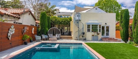 Welcome to The Diplomat's House!  The entire downstairs floor of the house is all yours.  Please keep in mind this is a shared property and there are guests above this unit. Salt water pool, spa, fire pit, and backyard with artwork and beautiful cust