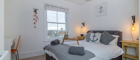 Large double bed with views over the bay