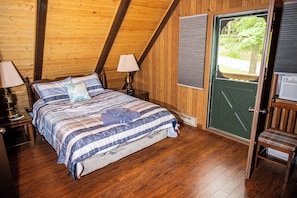 Queen-size bed and private porch in Master Bedroom